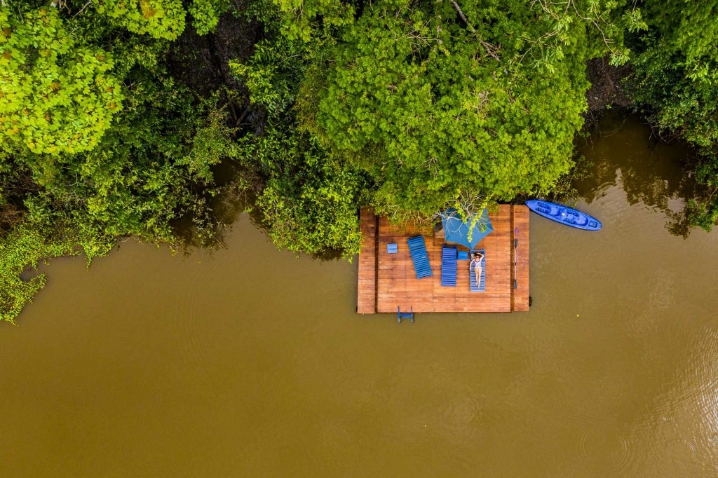 amazon forest iquitos peru drone aerial view lodge sunbathing