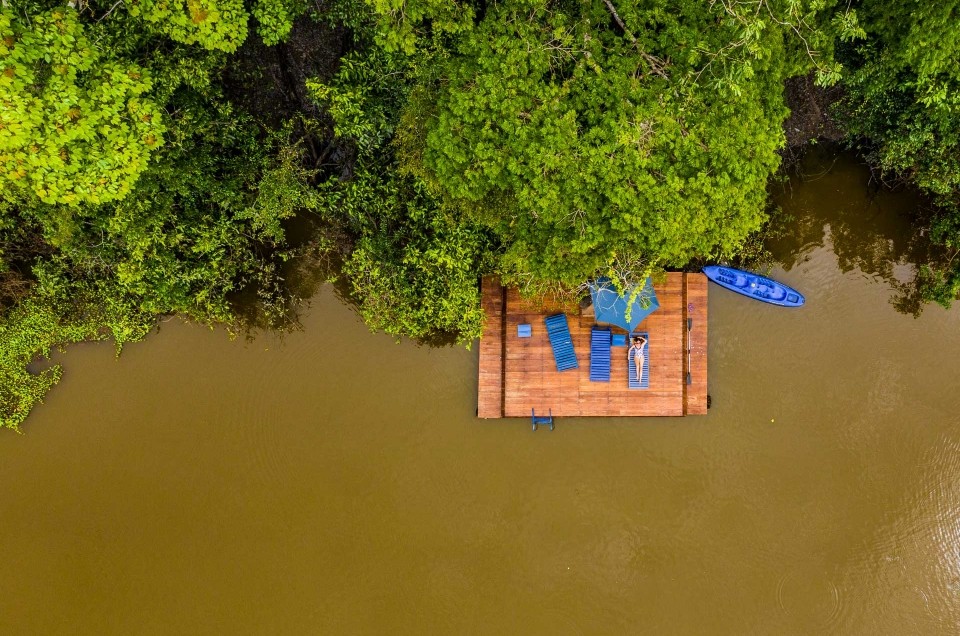 amazon forest iquitos peru muyuna lodge drone aerial view lodge sunbathing