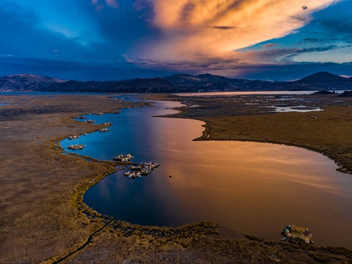 Uros Floating Islands Titicaca Lake Puno Peru aerial drone shot sunset