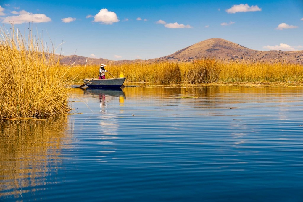 Uros Floating Islands Titicaca Lake Puno Peru reed worker boat