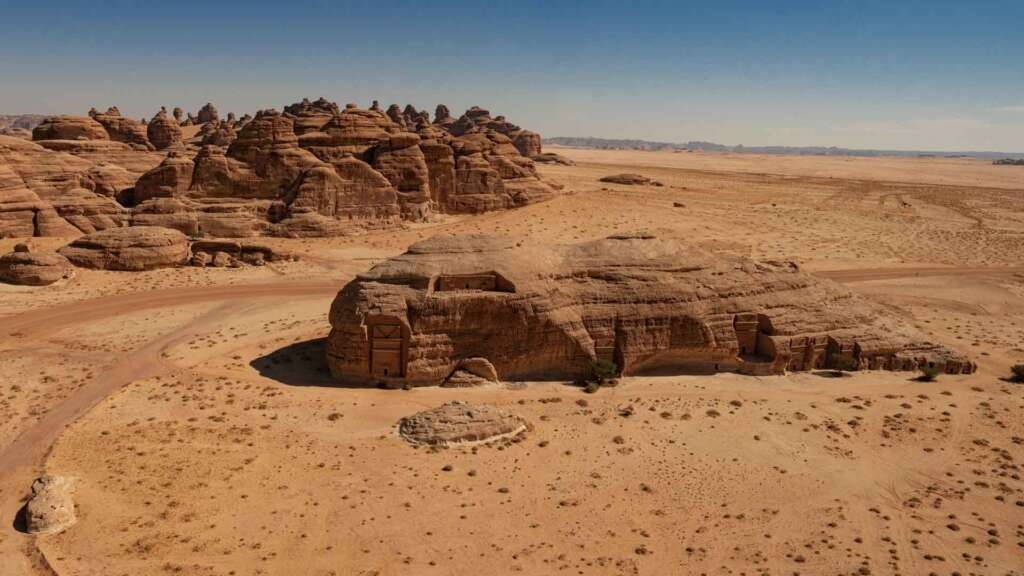 al ula saudi arabia hegra archeological site aerial helicopter drone view