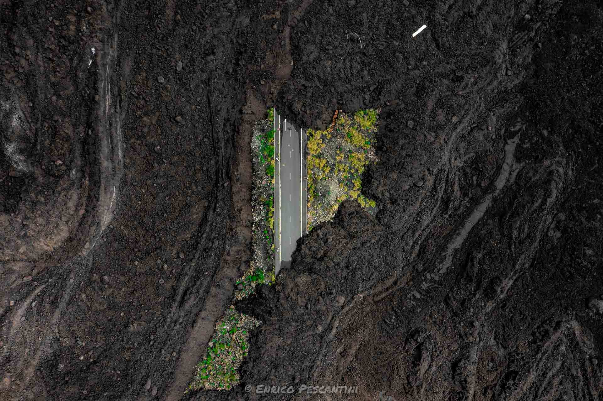 la palma volcano eruption aftermath road under lava rock
